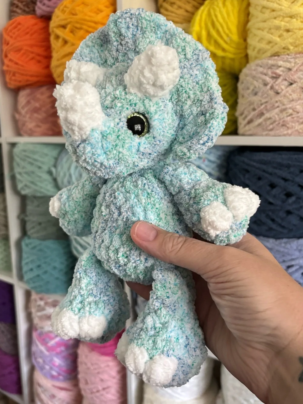 Crochet baby Triceratops plush.